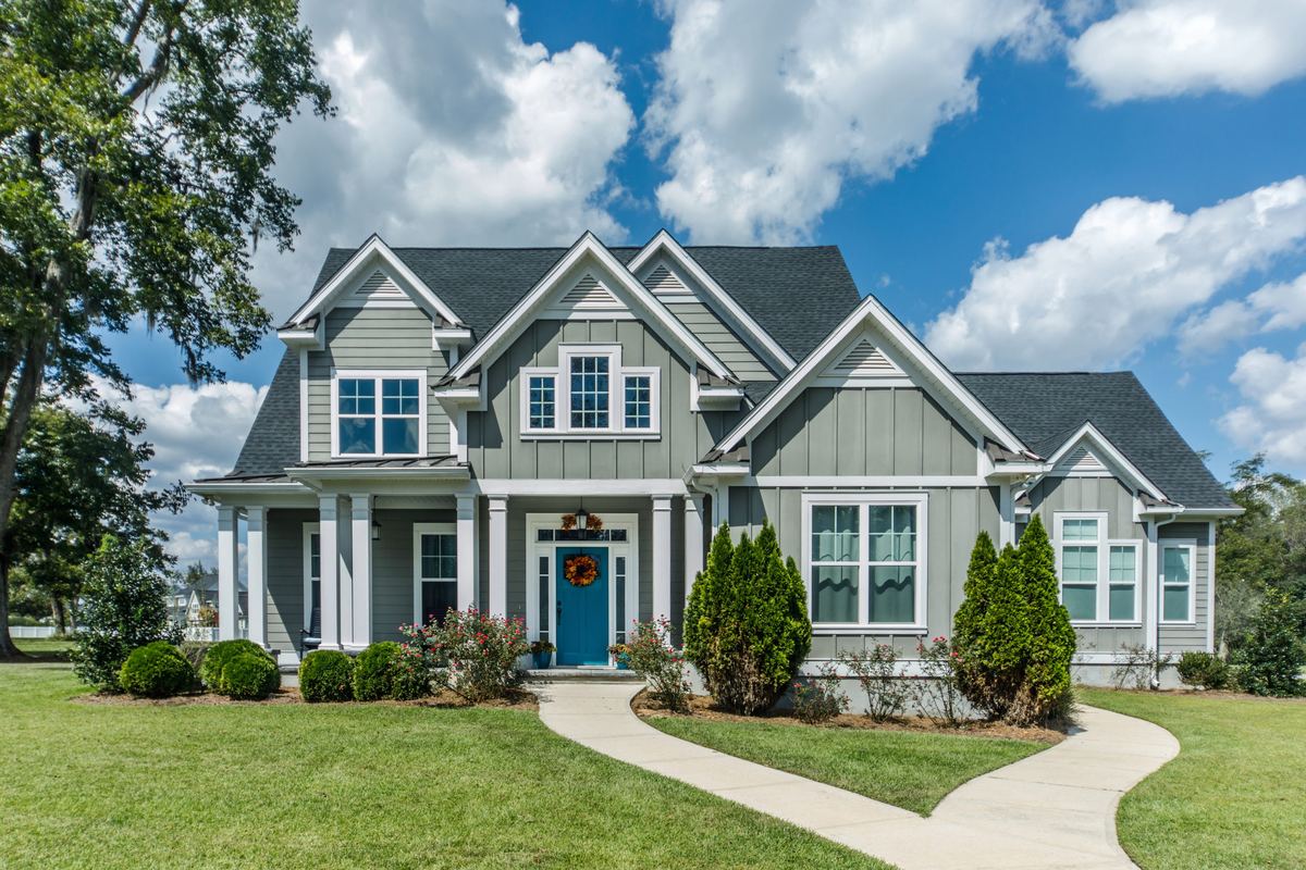 Two-storey grey family home with a covered front porch
